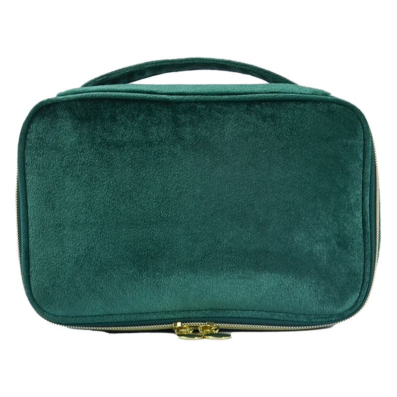 A green velvet carrying case with a handle and gold zipper.