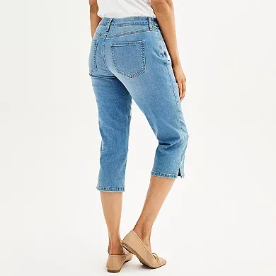 Light denim capris with a mid-rise waist, cropped legs with rolled cuffs, classic five-pocket styling, and button closure.