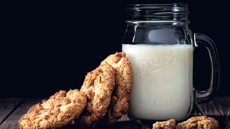 generic brand milk in mason jar with cookies