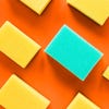 An orange background with various yellow sponges and one blue sponge.