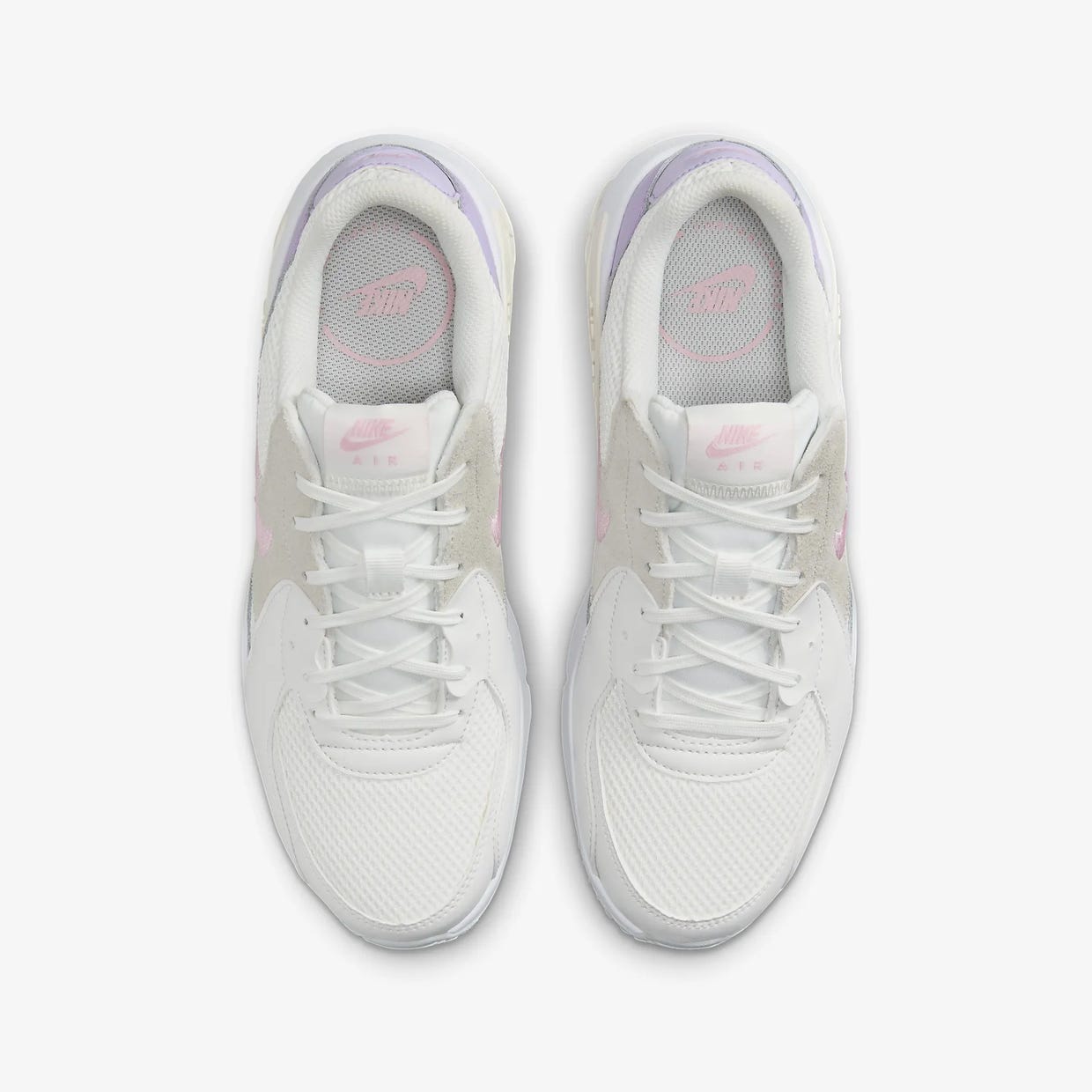 A pair of white sports shoes with pink and purple accents, featuring a mesh upper and cushioned soles.