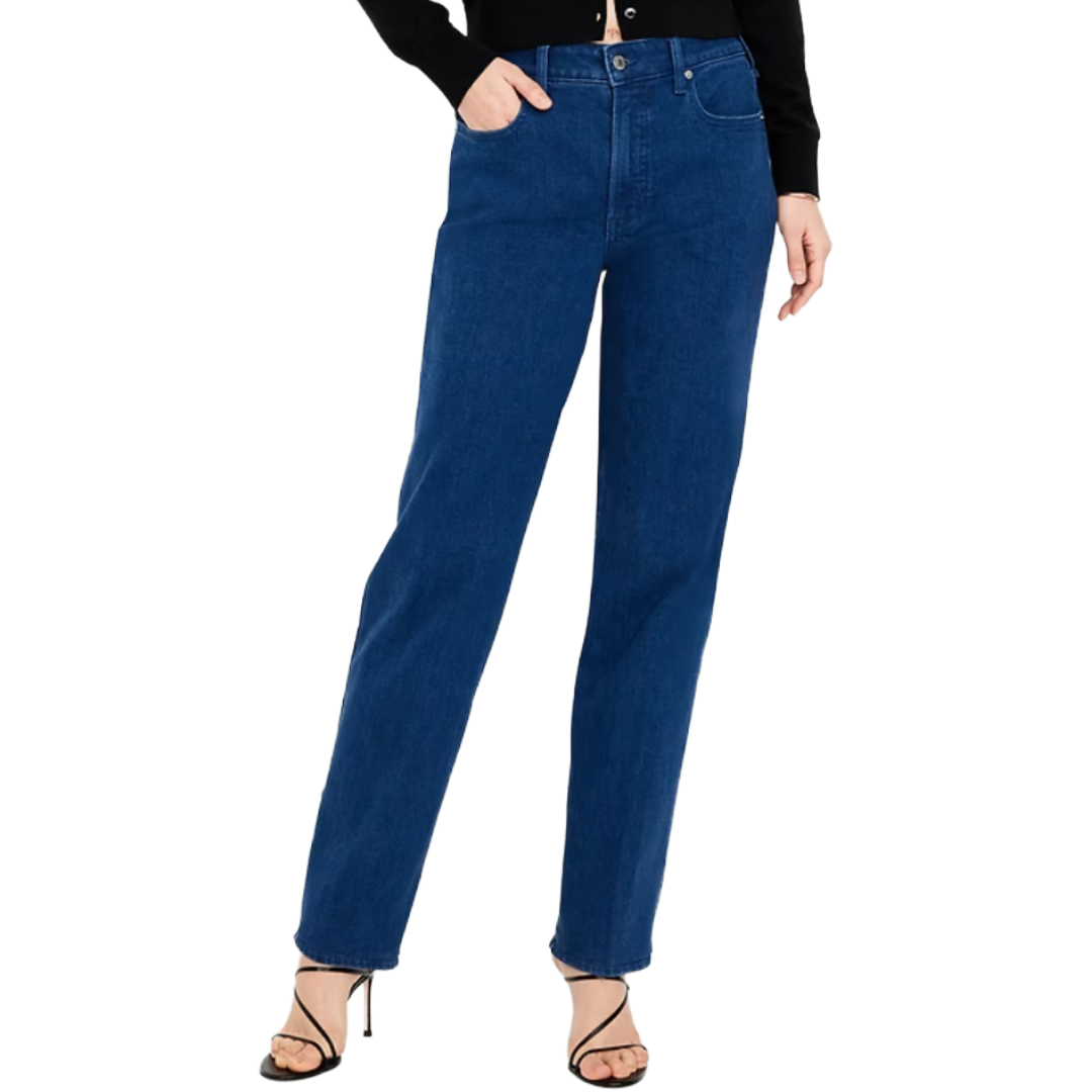 Dark blue straight-leg jeans paired with a black top and strappy high-heeled sandals.