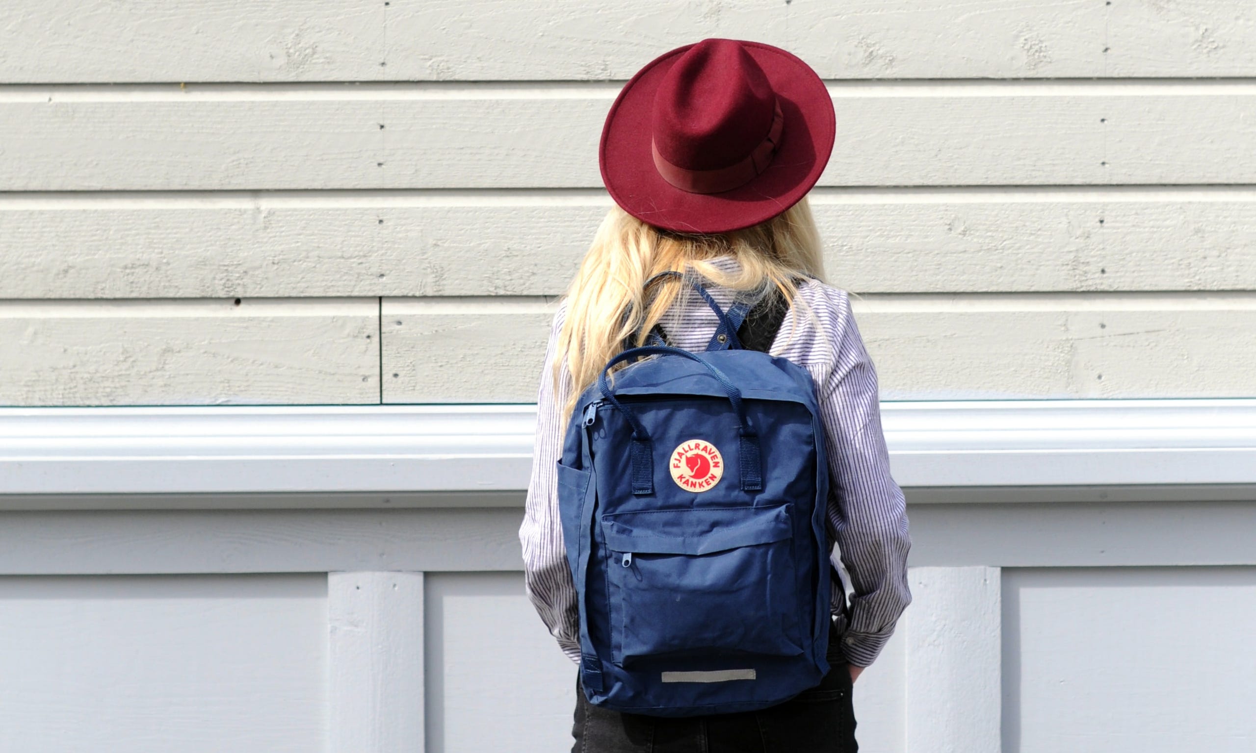 woman wearing hat and backpack