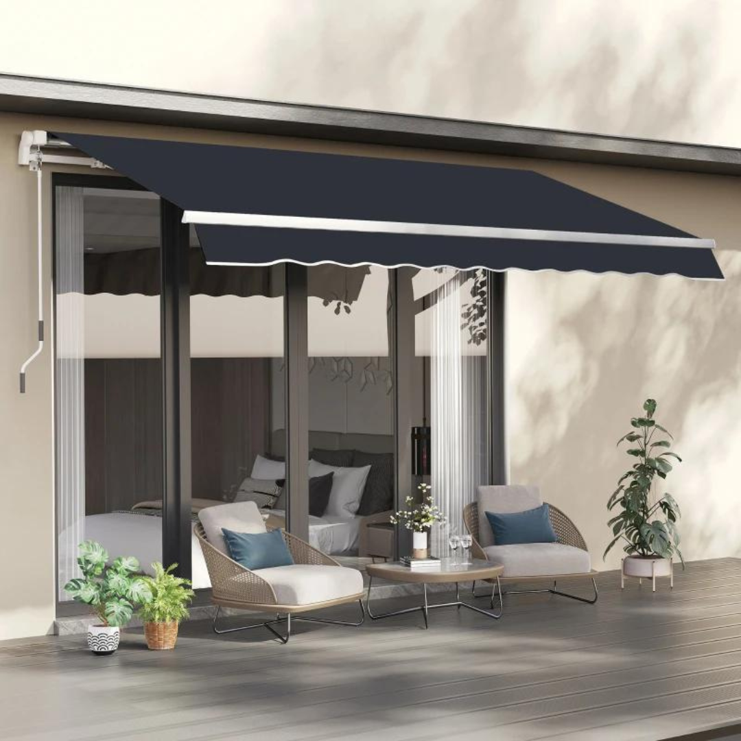 A retractable awning over a patio with two lounge chairs, a sofa, a coffee table, and plant decorations.