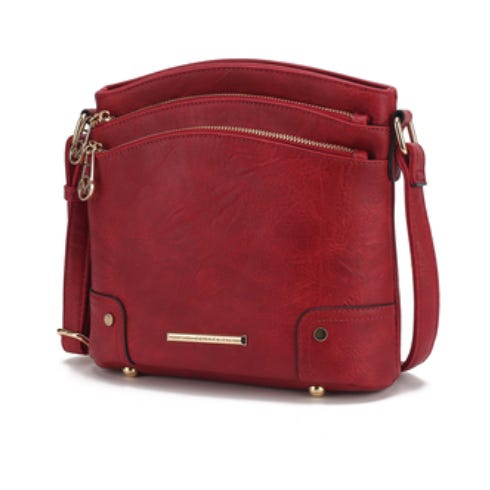 A red MKF crossbody bag features multiple zippered compartments, a sleek design, and gold-tone hardware with a detachable shoulder strap.
