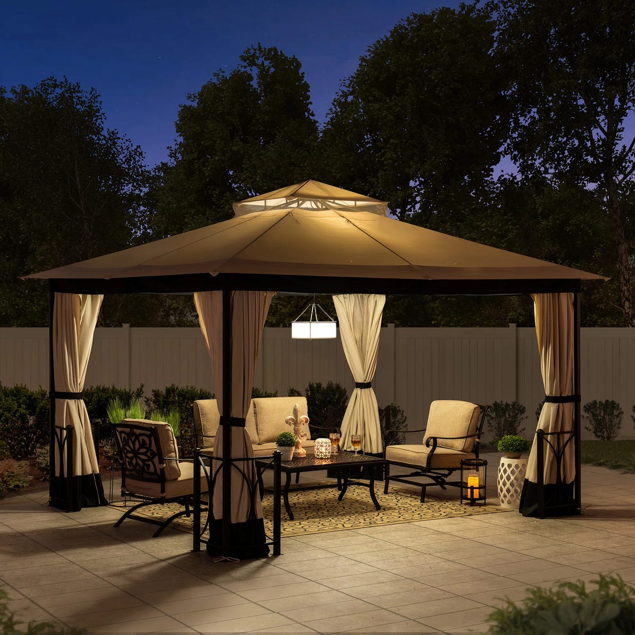 A lit gazebo with curtains, outdoor furniture including chairs, a sofa, and a coffee table, set on a patio at dusk.