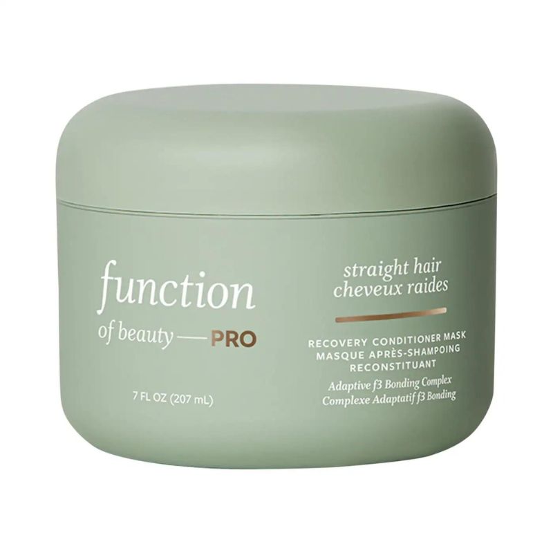 A green container labeled \“Function of Beauty PRO\“ for straight hair, described as a recovery conditioner mask with Adaptive 3 Bonding Complex, 7 fl oz (207 ml).