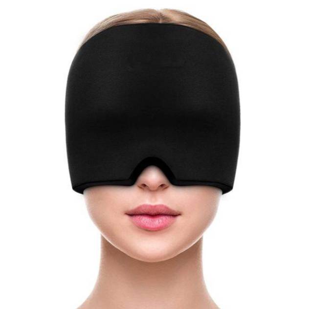 A person wearing a full-coverage black sleep mask.