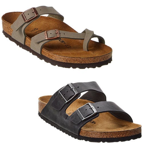 Two pairs of buckle-strap sandals with cork soles, one in olive green and one in black.