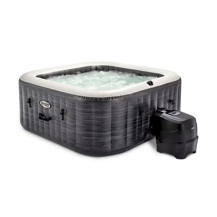 A square, 4-person inflatable hot tub with a textured gray exterior and white interior top rim, equipped with a digital control panel and external pump.