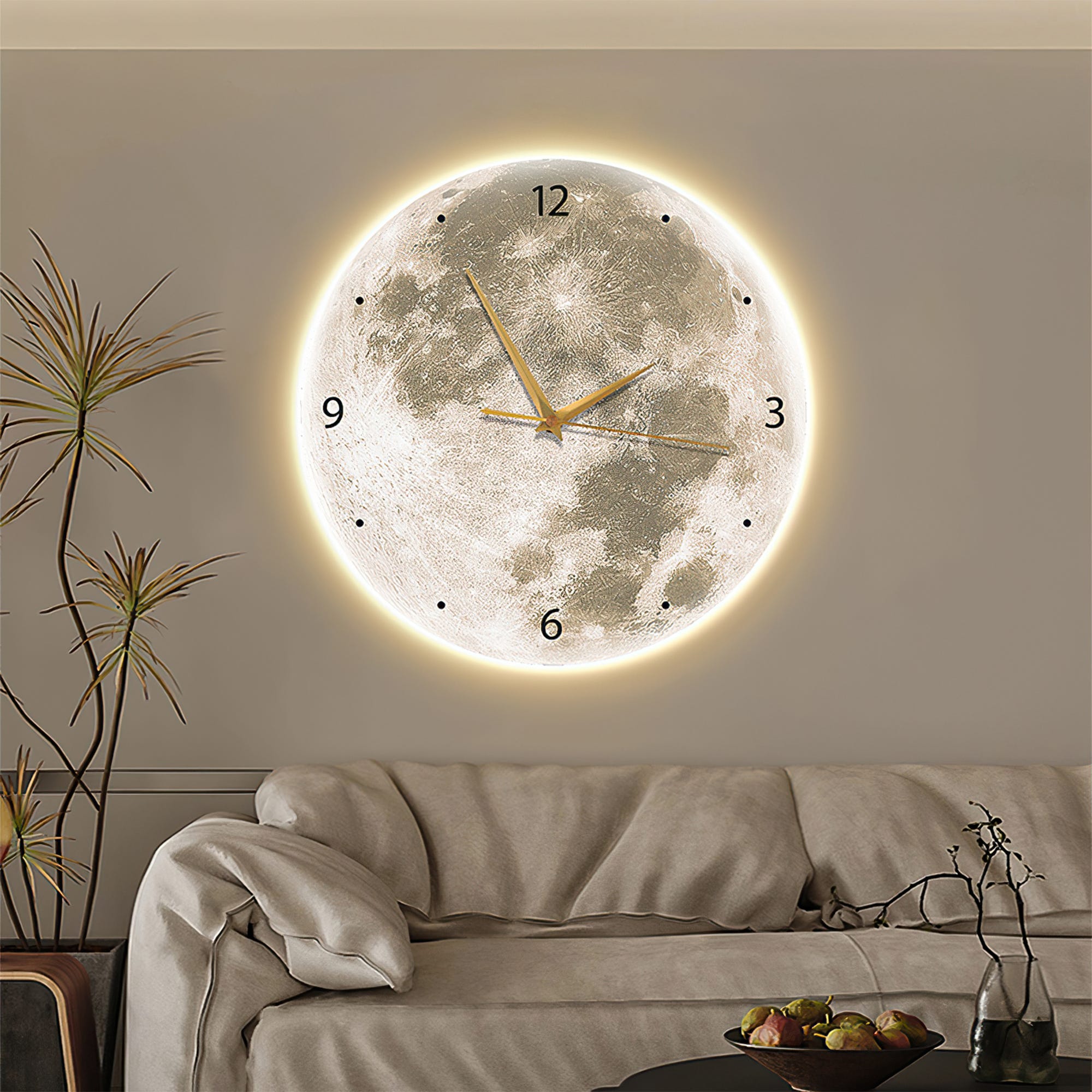 A wall clock designed to resemble the full moon hangs above a couch, with glowing edges and clock hands and numbers in a golden hue.