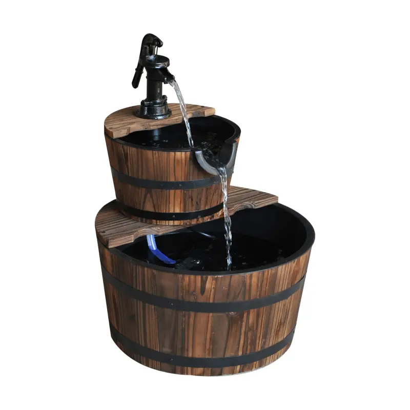 A two-tiered wooden barrel fountain with a black pump faucet on the upper tier, cascading water into the lower tier.