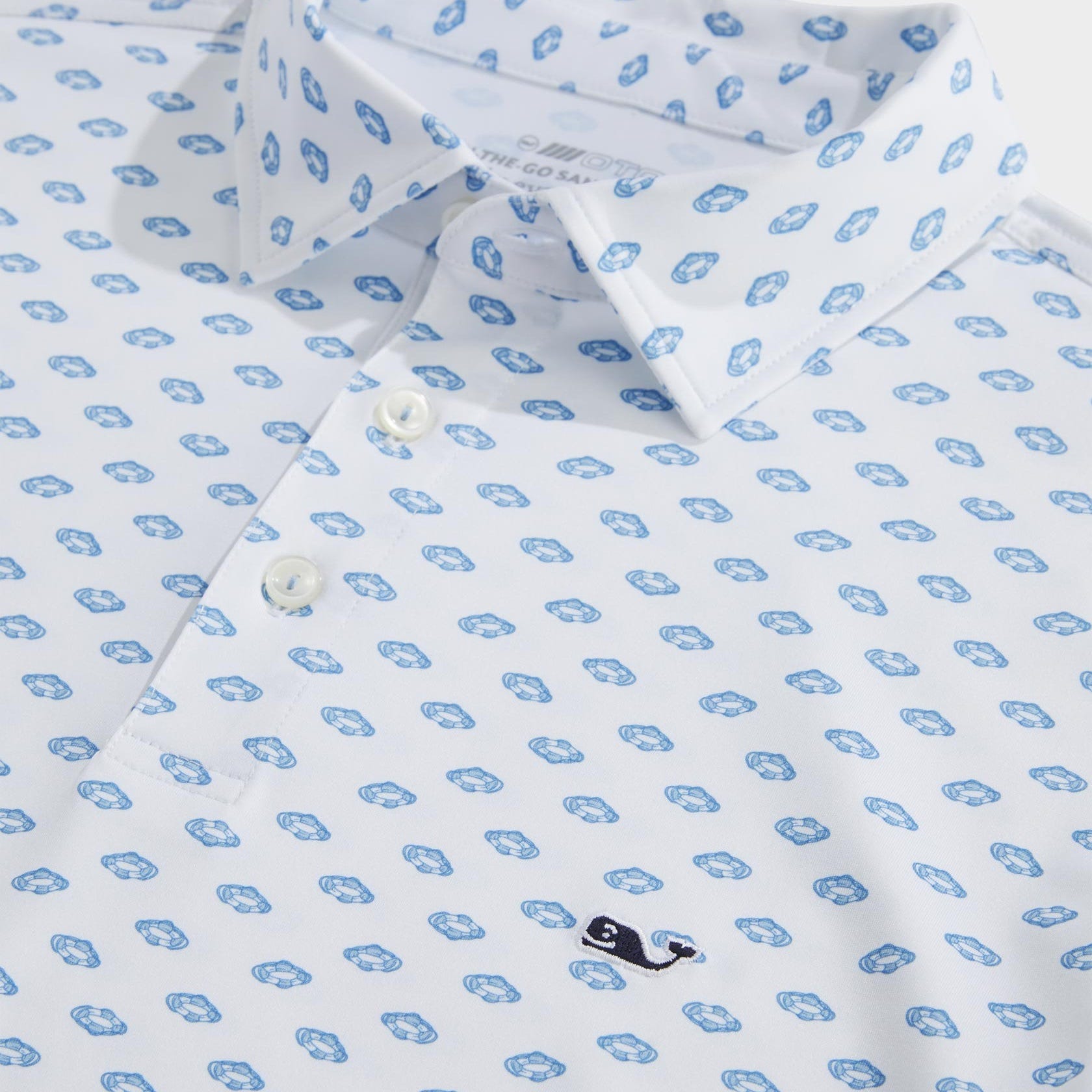 A detailed white dress shirt with a blue repeating pattern and a button-down collar.
