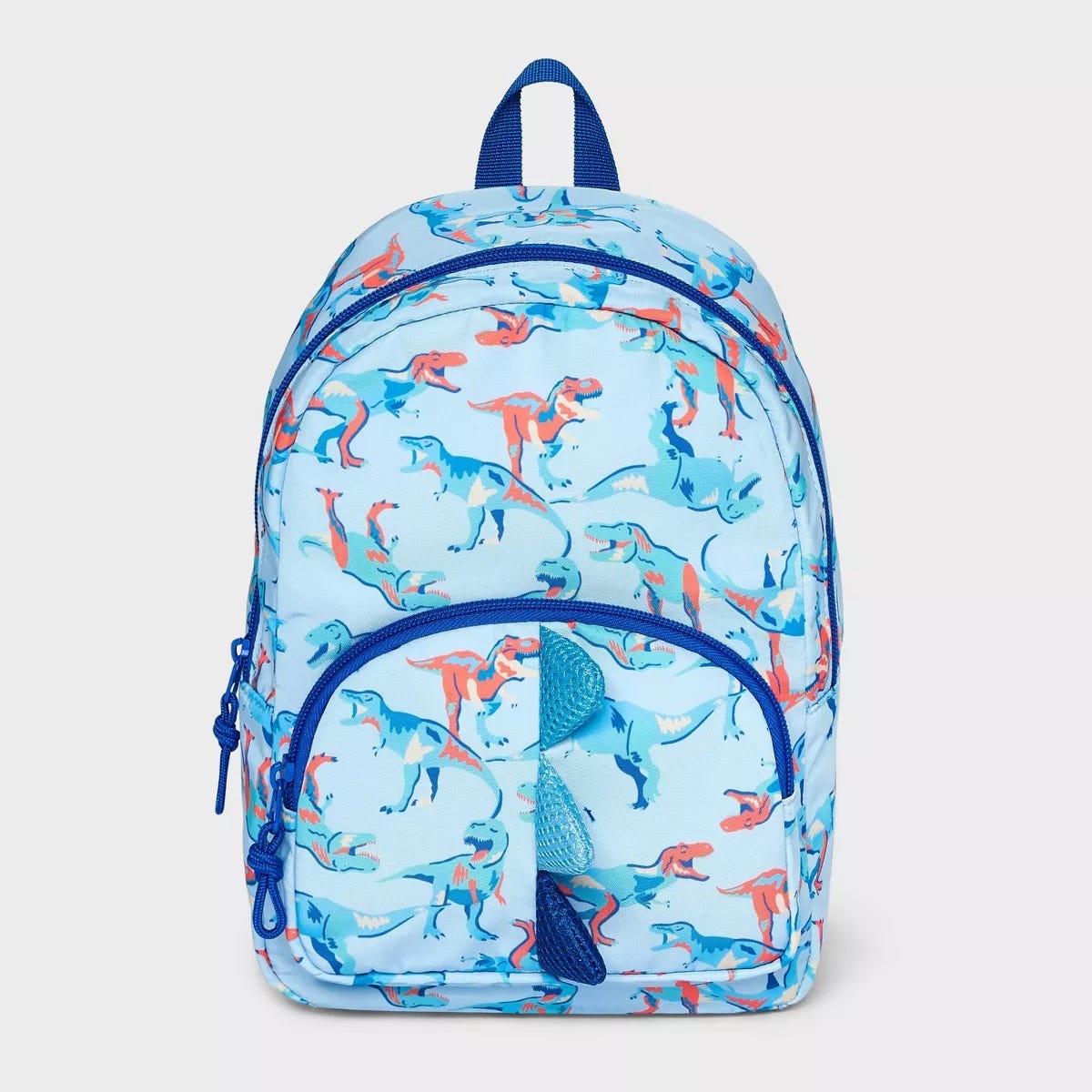 A light blue backpack with red and blue dinosaur prints.