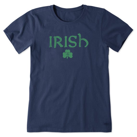 Navy blue T-shirt with the word \“IRISH\“ in green, featuring a shamrock below with \“Life is Good\“ text.