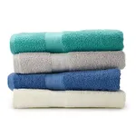 A stack of five plush bath towels in various solid colors including teal, grey, blue, and creamy white.