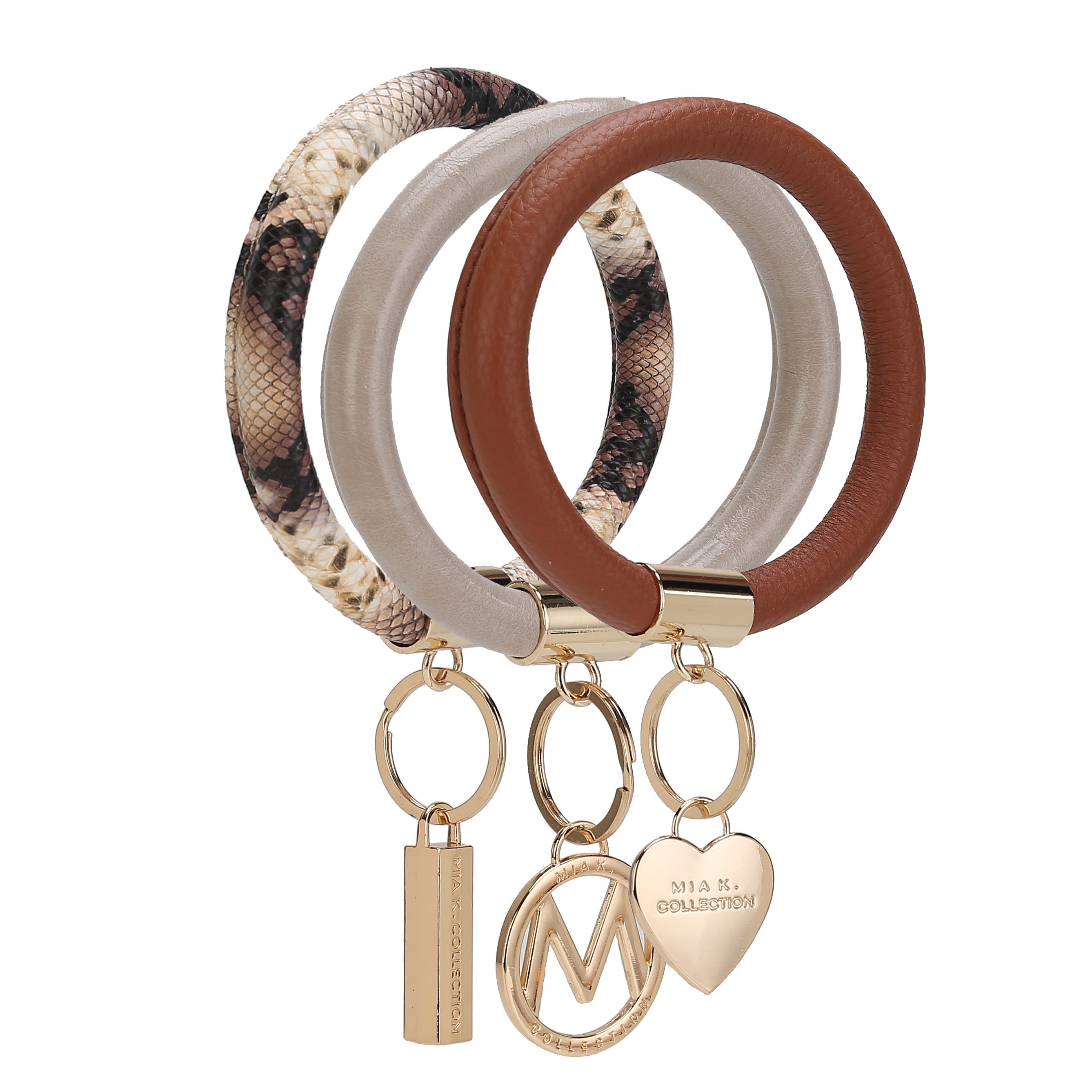 Three round keychain wristlets are shown, each with a different design: brown leather, beige faux leather, and snakeskin pattern. They feature gold accents and charms with the text \“MIA K. COLLECTION.\“