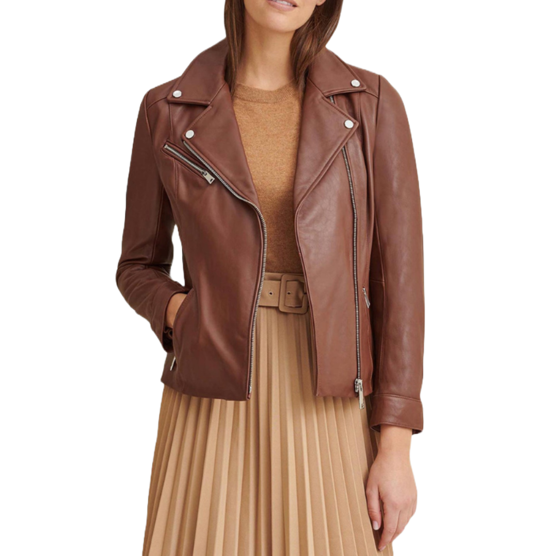 Brown leather biker jacket with silver hardware, featuring an asymmetrical zip closure and zippered pockets. It is paired with a beige pleated skirt and matching top, adding a stylish contrast.