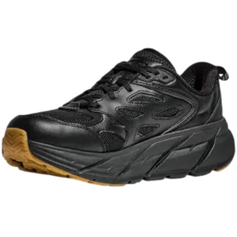 Black athletic sneaker with a thick, cushioned sole and gum-colored tread, featuring mesh and synthetic materials for breathability and support.