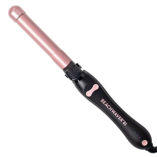 The Beachwaver Rotating Curling Iron is a hair styling tool with an automatic rotating feature and a slim pink barrel, designed for creating waves and curls. It features a black handle with a few control buttons and is suitable for various hair types.