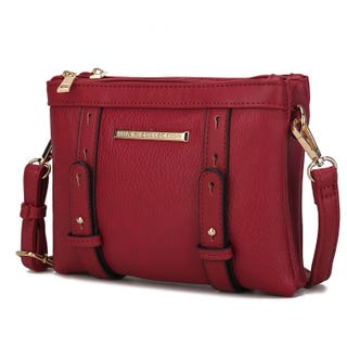 A red crossbody handbag with a textured exterior and gold-tone hardware accents.