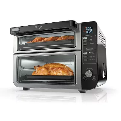 Ninja 12-in-1 Double Oven features two levels with a digital control panel on the right side, baking bread on the top and a whole chicken on the bottom.