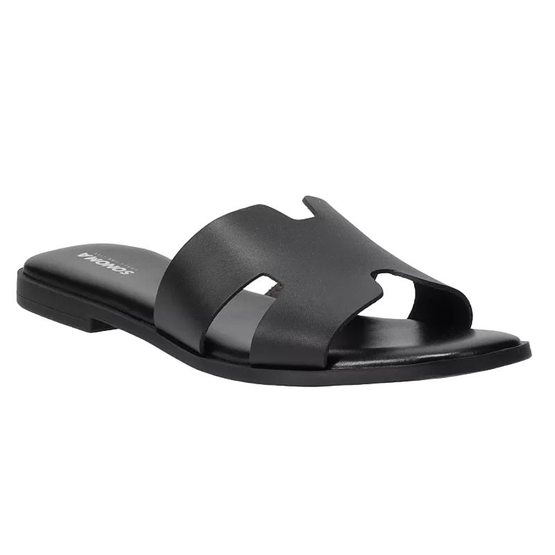 Black slide sandal with a wide strap, featuring cut-out details and a flat sole.