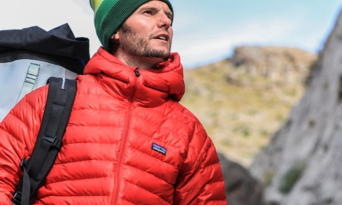 Man on mountain in red Patagonia jacket