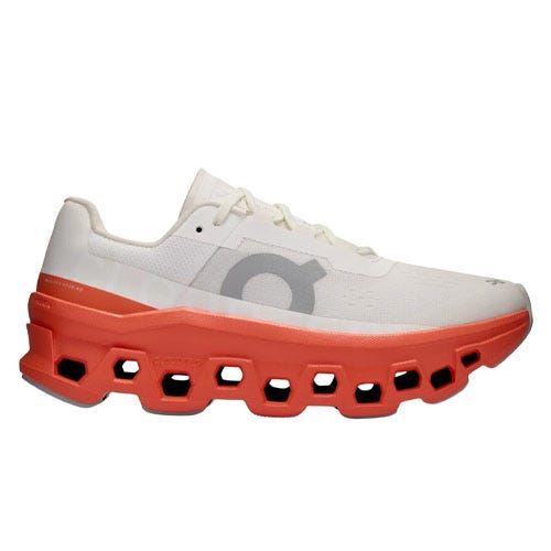 A white and orange athletic shoe with a unique honeycomb sole design and a large logo on the side.