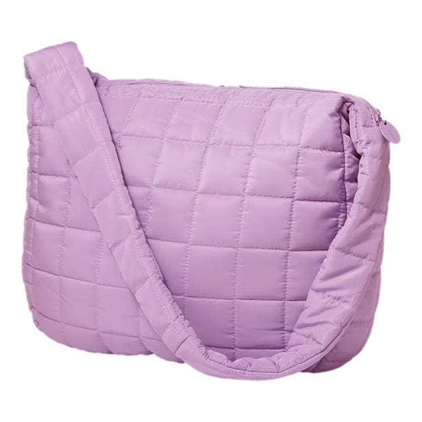 A lavender, quilted crossbody bag with a zipper closure and a wide strap.