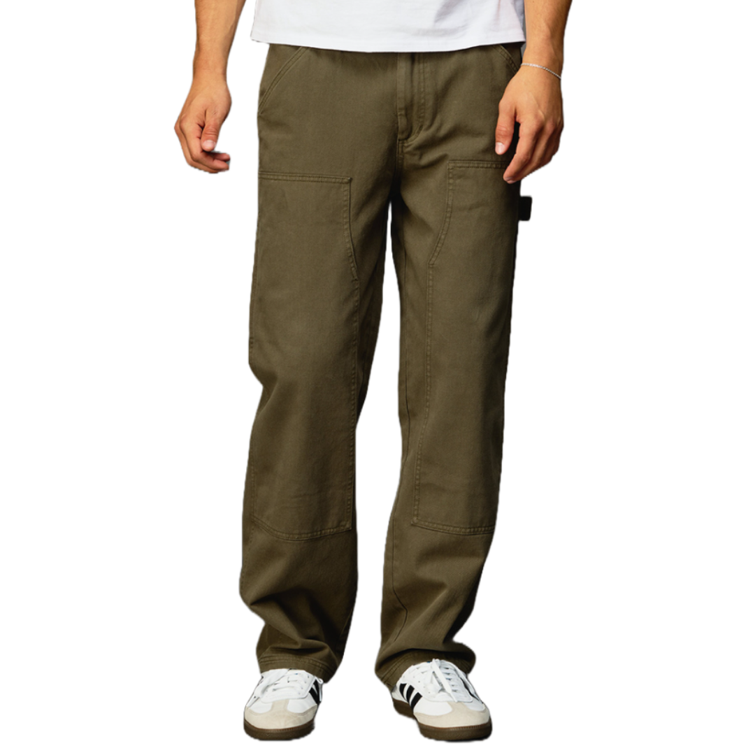 A person is wearing olive green cargo pants paired with white and black sneakers, and a white shirt.