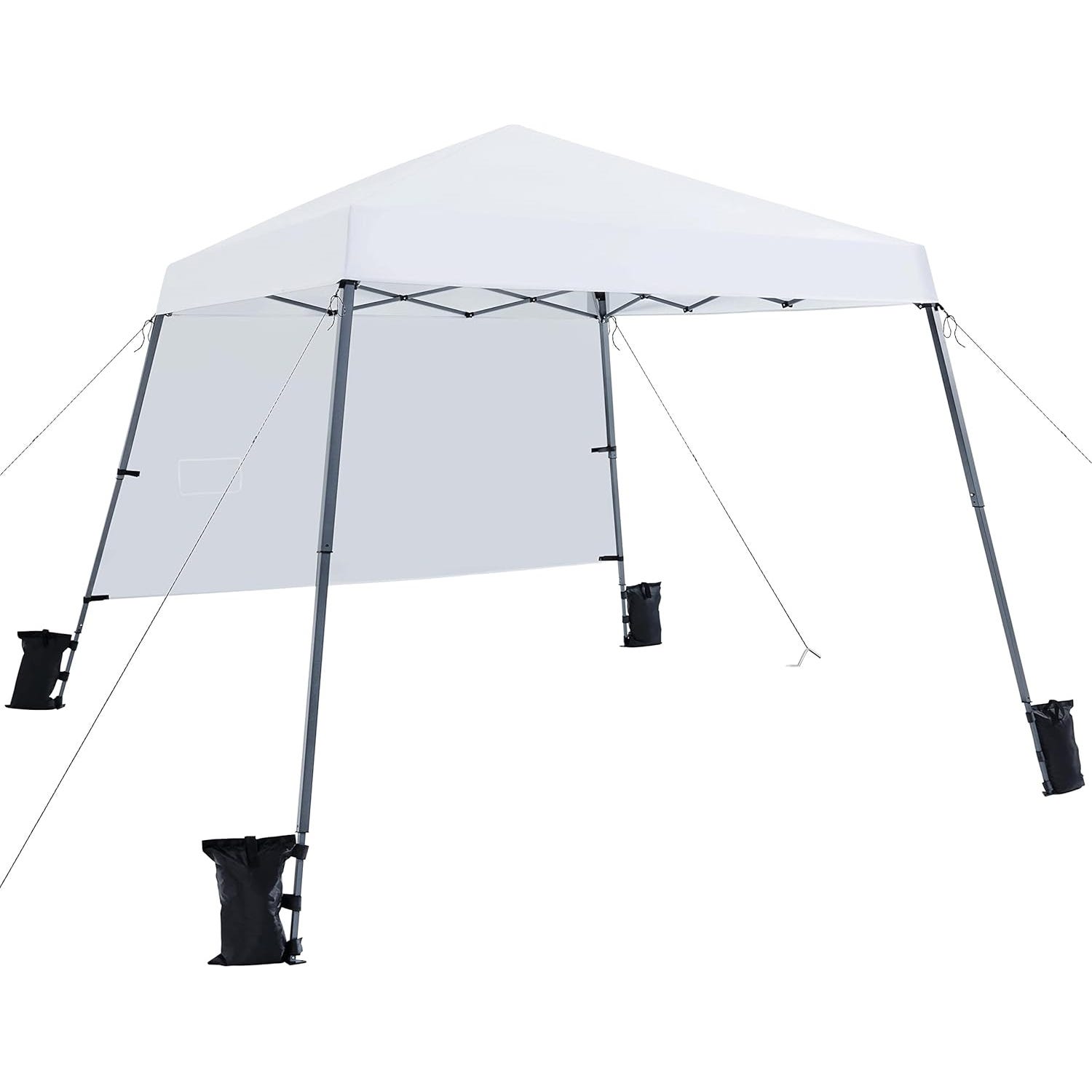 A white pop-up canopy tent with a triangular roof, supported by four metal legs. It includes a sidewall for extra shade and stability, and is anchored with black sandbags and guy lines for outdoor use.