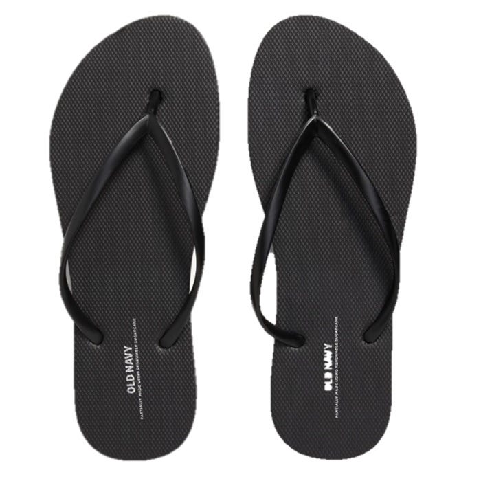 Black flip-flops with simple design, featuring textured soles and thin black straps. Brand name \“Old Navy\“ visible on the footbed.