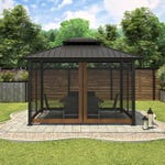 A gazebo with a dark roof and frame, glass panels, and outdoor chairs inside on a patterned patio area.