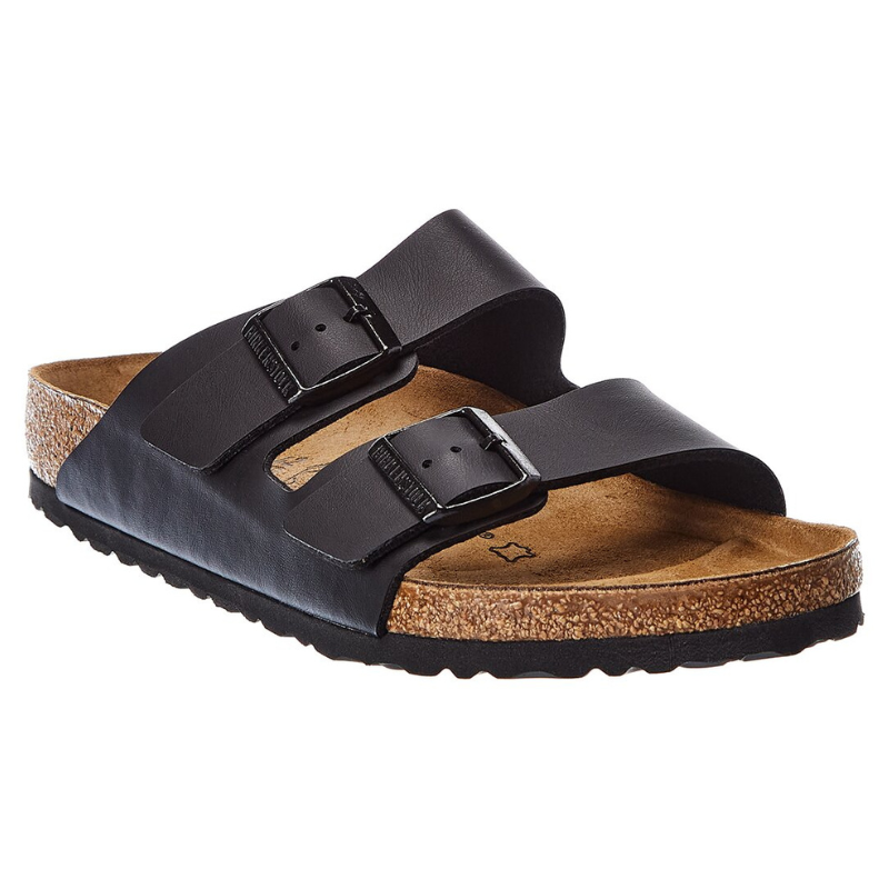 A black two-strap sandal with adjustable buckles, featuring a cork footbed and rubber sole.