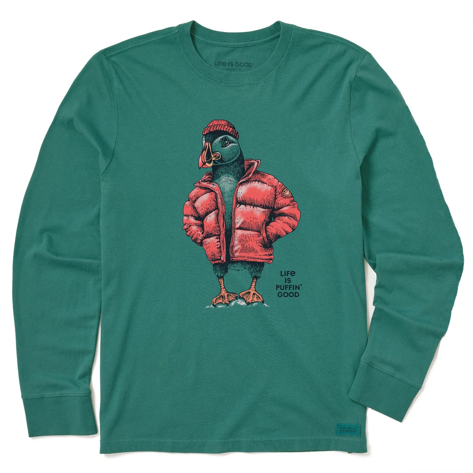 Green long sleeve tee featuring a puffin wearing a red puffer jacket and beanie, with the text \“Life is Puffin’ Good\“ printed beneath the graphic.