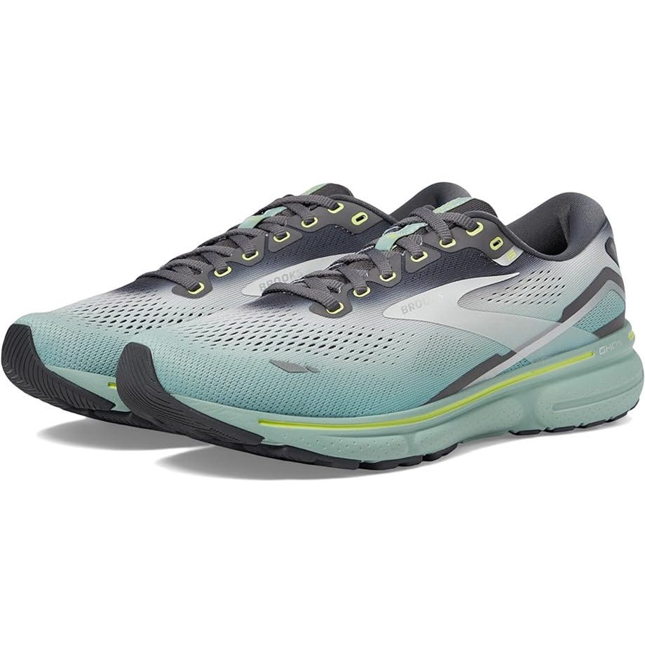 A pair of light blue and gray running shoes with yellow accents.