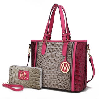 A taupe and burgundy handbag with a matching wristlet, both featuring a crocodile skin texture and gold-tone emblem detail.