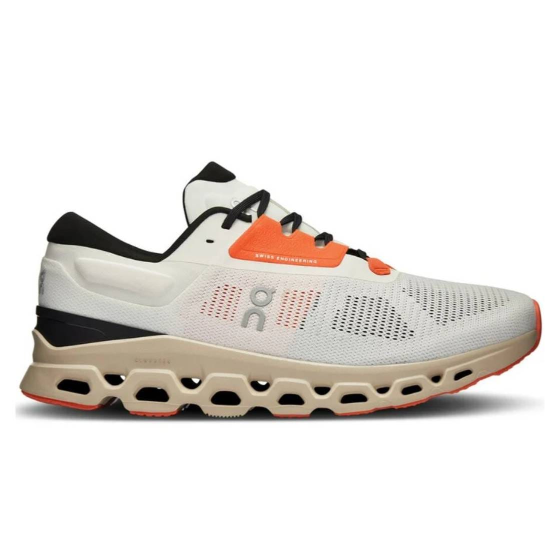 A pair of On Running Cloudstratus 3 shoes with a white to gray gradient, black detailing, orange laces, and tan and black soles with distinctive hole patterns.