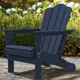 A navy blue Adirondack chair is shown in a garden setting, with green foliage and blooming hydrangeas in the background.