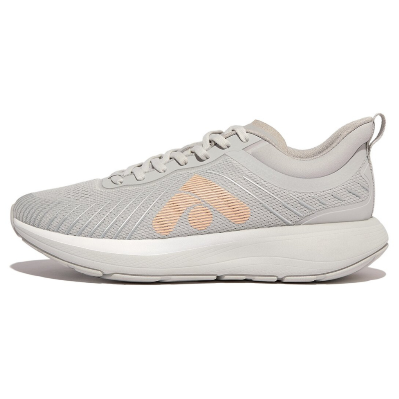 A light gray athletic shoe with a peach logo, featuring a mesh upper, lace-up design, and cushioned sole.