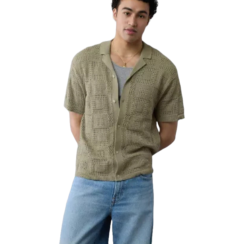 Olive open-knit textured polo shirt with short sleeves, featuring a button-down front, worn over a gray undershirt, and paired with light blue jeans.