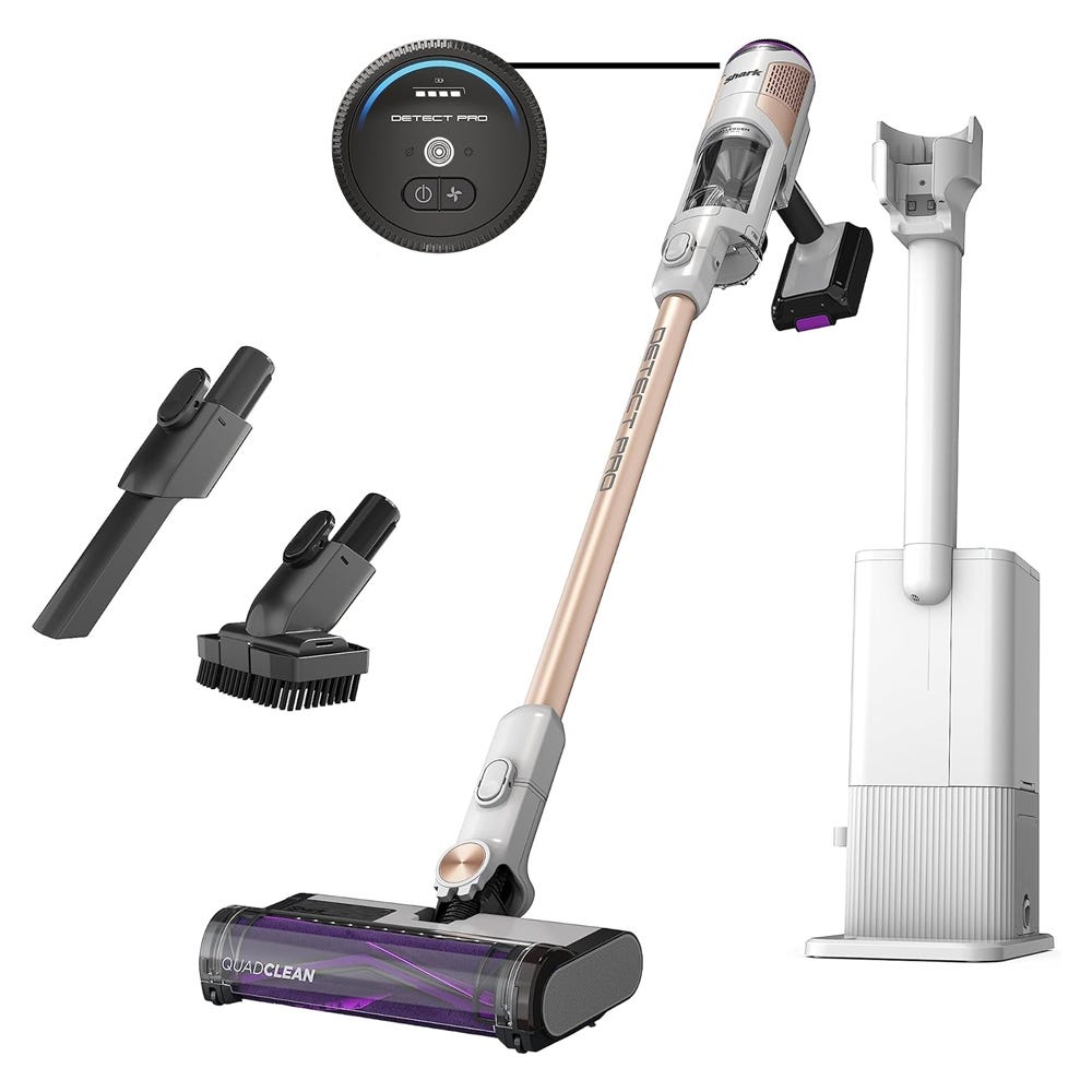 A cordless stick vacuum cleaner with multiple attachments and a charging dock station.