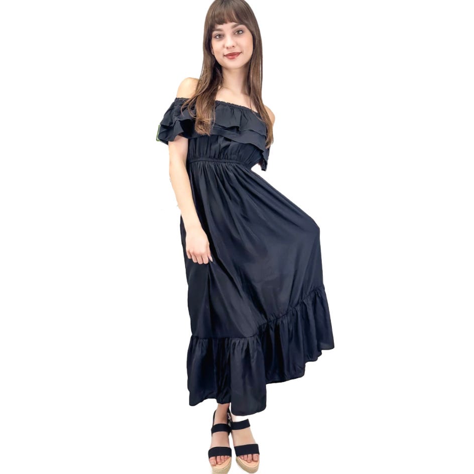 A woman is wearing an off-shoulder black maxi dress with ruffles and black strappy sandals.