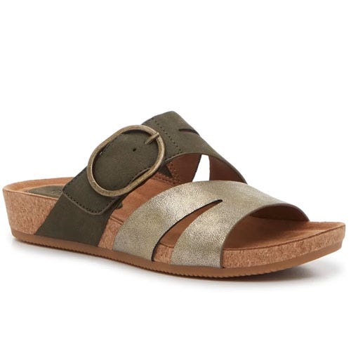 A wedge sandal with a cork sole features a criss-cross strap design in olive green and metallic gold, accented by a large decorative buckle.
