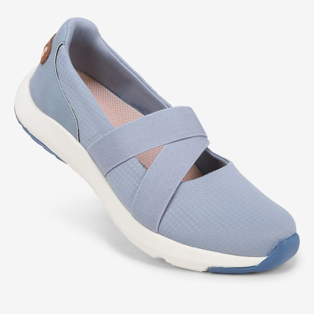 Light blue women's slip-on shoe with elastic crisscross straps and a white sole.