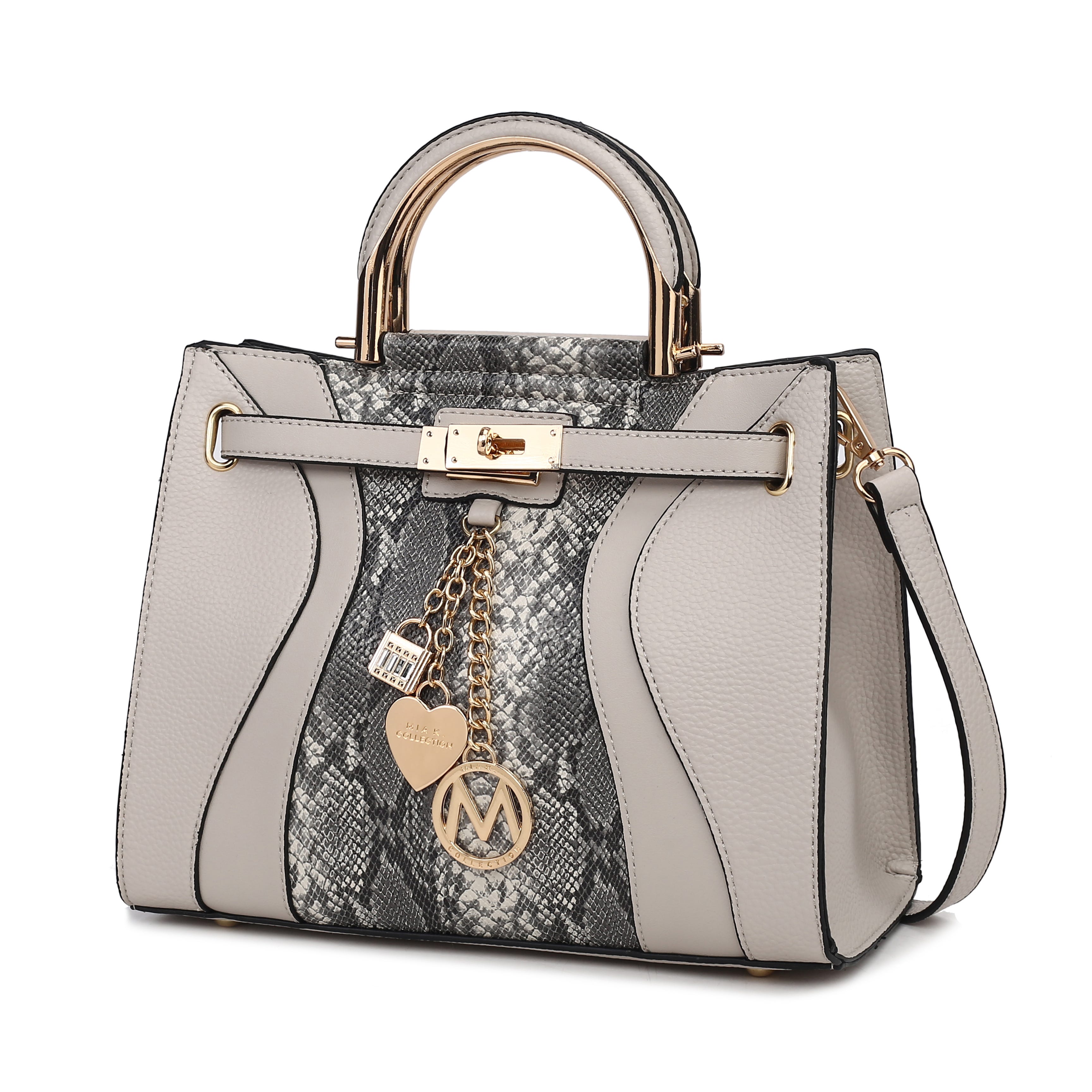 A stylish handbag with gray and snake-print panels, gold-tone hardware, and decorative charms, including a padlock and heart. Featuring dual handles and a detachable strap.