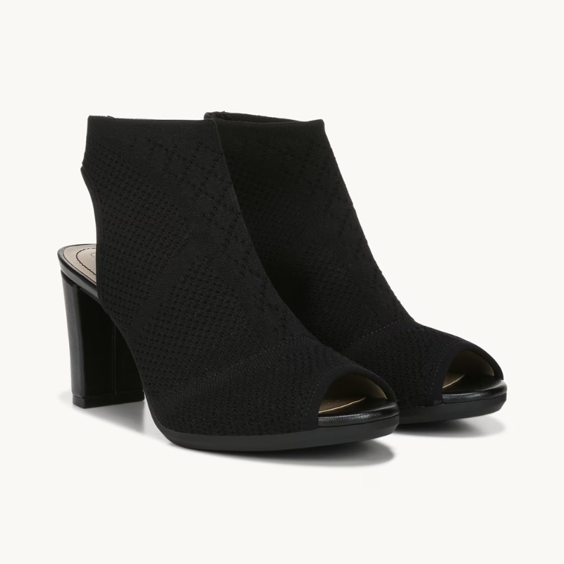 This is a pair of black, open-toe slingback heels with a chunky heel, featuring a textured knit construction.
