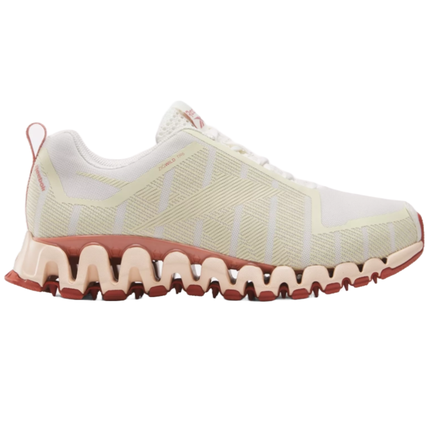 Reebok ZigWild Trail 6 Shoes feature a cream and beige upper with geometric patterns, a distinctive zigzag midsole in pink tones, and pull-tab detailing. Designed for trail running, they offer cushioning and traction.
