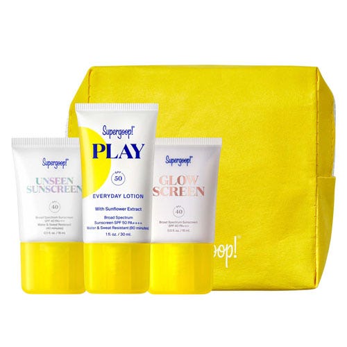 Three Supergoop! sunscreen products: Unseen Sunscreen, PLAY Everyday Lotion, and Glow Sunscreen, in a yellow pouch.